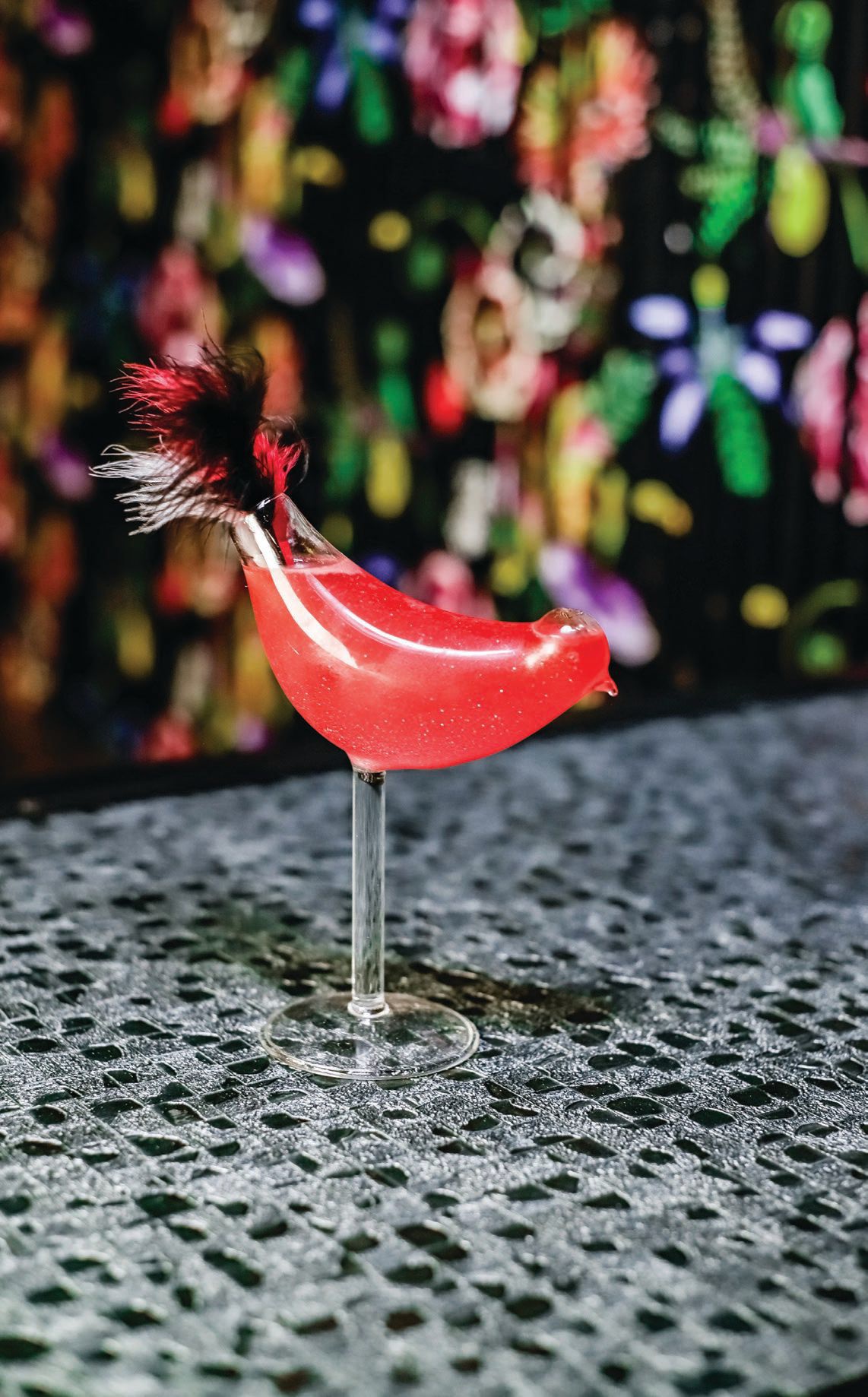 Eye-catching cocktails at Harper’s include the Bye Bye Birdie made with Grey Goose Le Citron, orange liqueur, cranberry, fresh lime, lemon grass reduction and luster dust. PHOTO BY KAYLA ENRIGHT