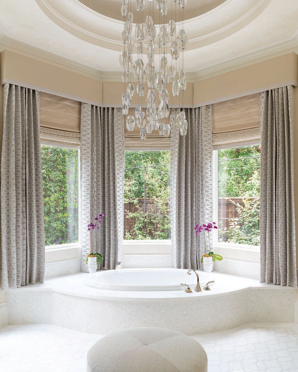 Her primary bath touts a stunning chandelier from Wired Custom Lighting. PHOTOGRAPHED BY DAN PIASSICK