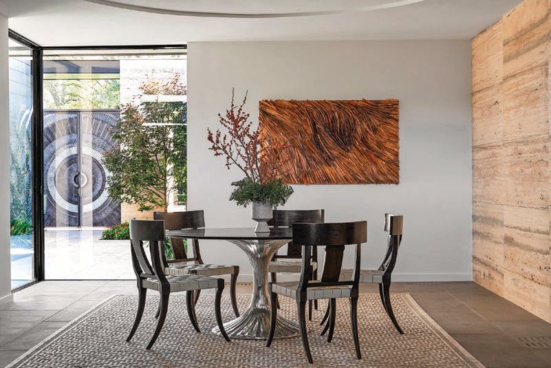 The dining room offers gorgeous indoor-outdoor views of the home. PHOTOGRAPHED BY NATHAN SCHRODER
