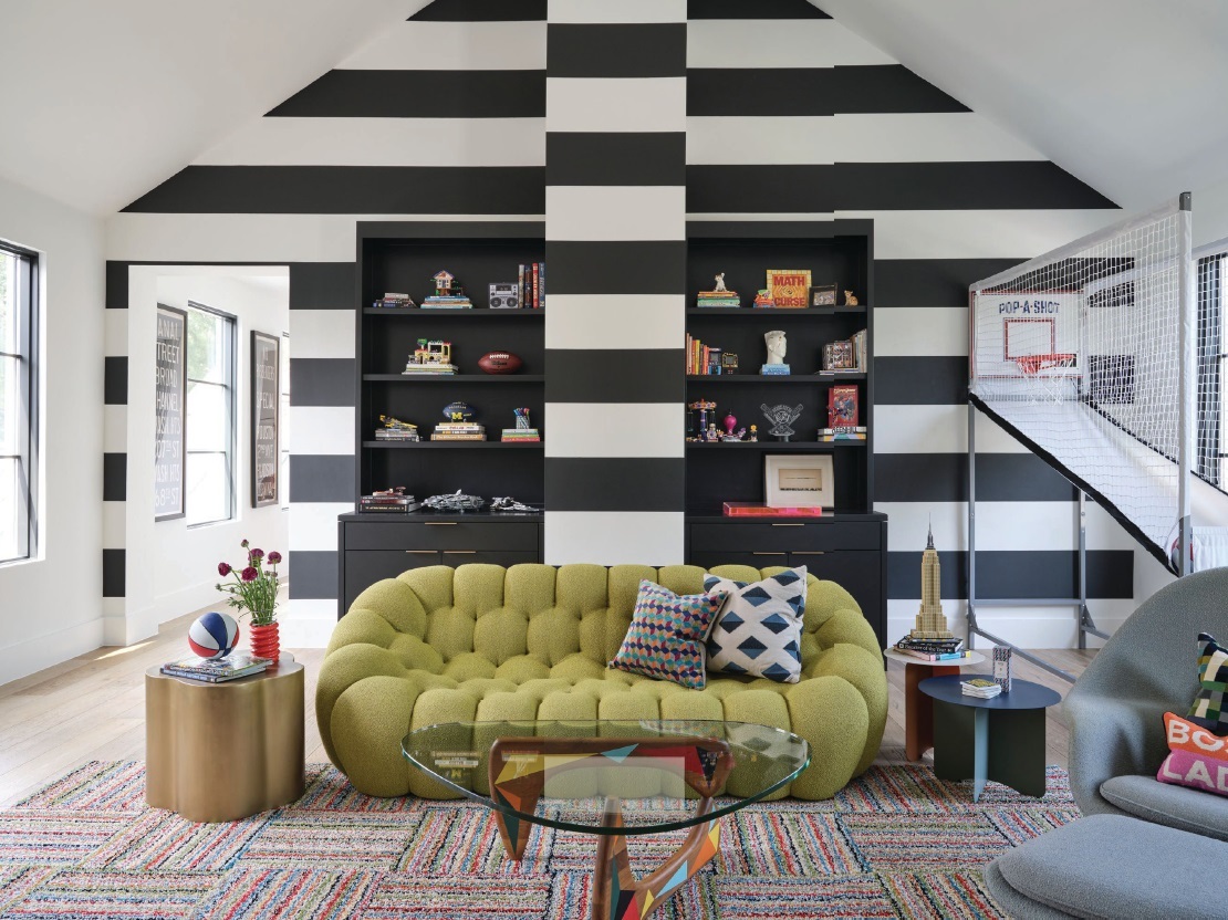 The playroom features a fun colorway through a bold wall covering PHOTOGRAPHY BY CODY ULRICH