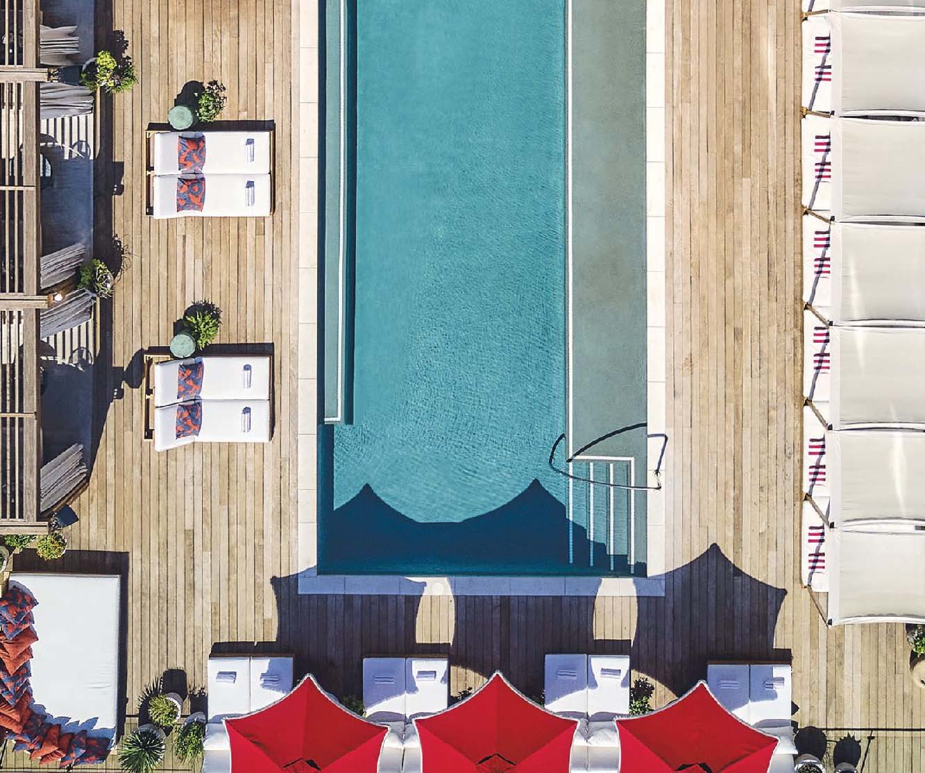 The pool at the Virgin Hotel touts a sizzling scene. PHOTO BY MARTIN BARRAUD/ISTOCK